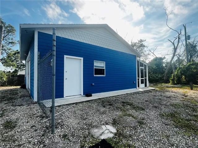 a view of a backyard of the house