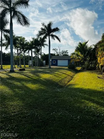 a view of a playground with basketball court