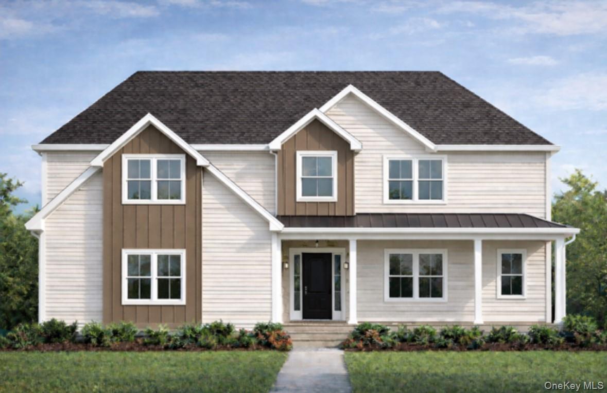 View of front of home with a porch, board and batten siding, a front lawn, and a shingled roof