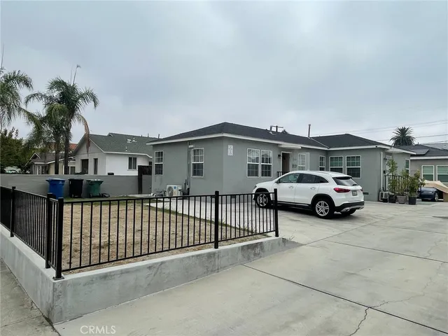 a view of a car parked in front of a house