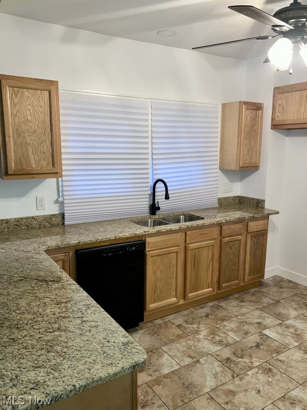 2108 Volney Road Youngstown, OH 44511 - Photo 3 of 27 Kitchen with light tile flooring, dishwasher, sink, dark stone countertops, and ceiling fan