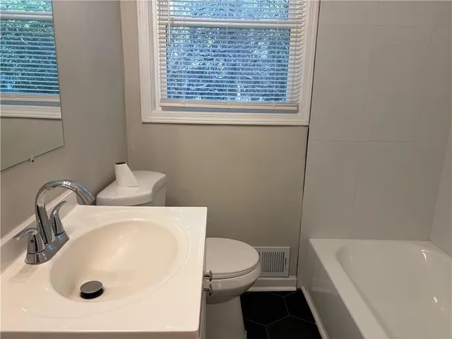 a bathroom with a sink and a toilet