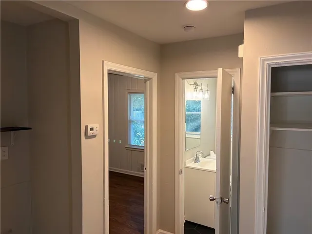 a view of a bathroom from a hallway