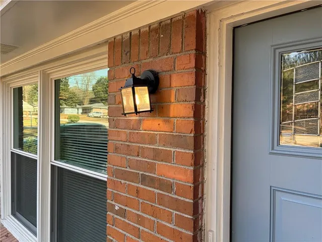 a view of a door and wooden floor