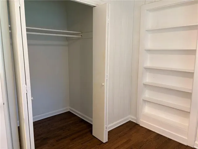 a view of an empty walk in closet