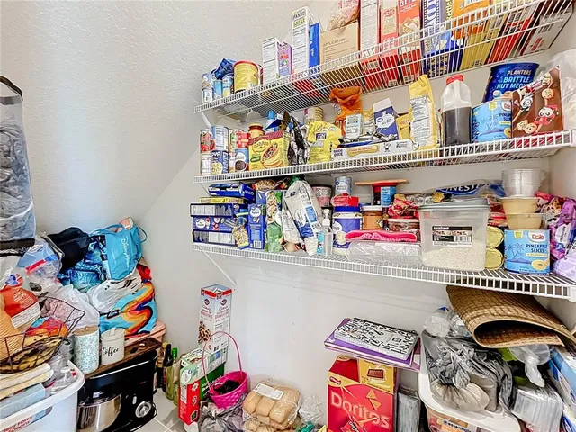 a utility room with storage and utility