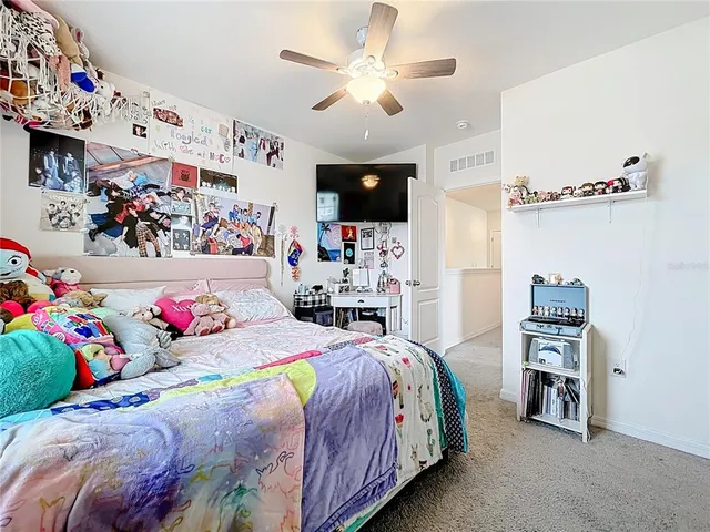 a bedroom with a bed and dresser