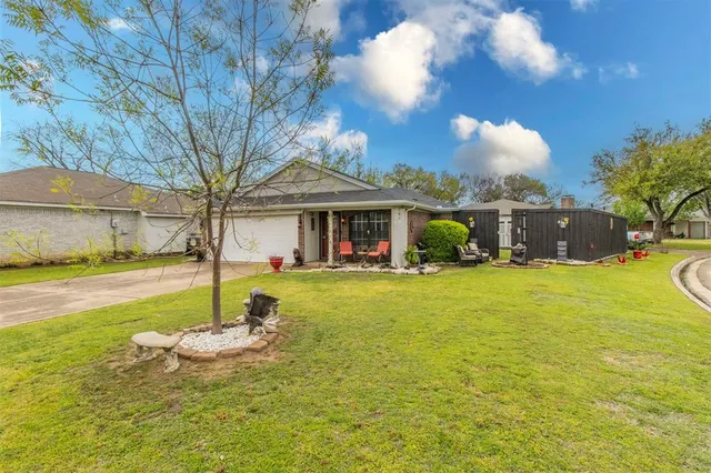 a view of a house with swimming pool and a yard