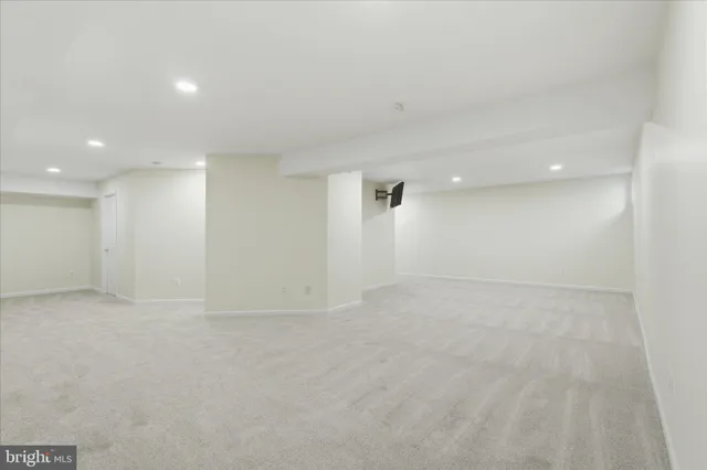 an empty room with an empty space and wooden floor