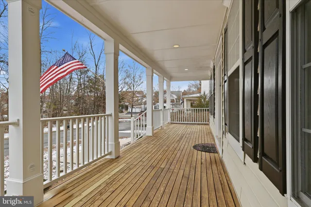 a view of a balcony with wooden floor