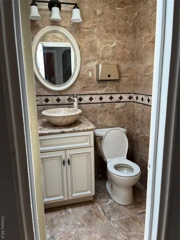 a bathroom with a toilet and a sink