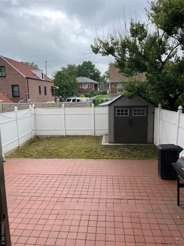 a bathroom with a granite countertop sink a toilet and shower