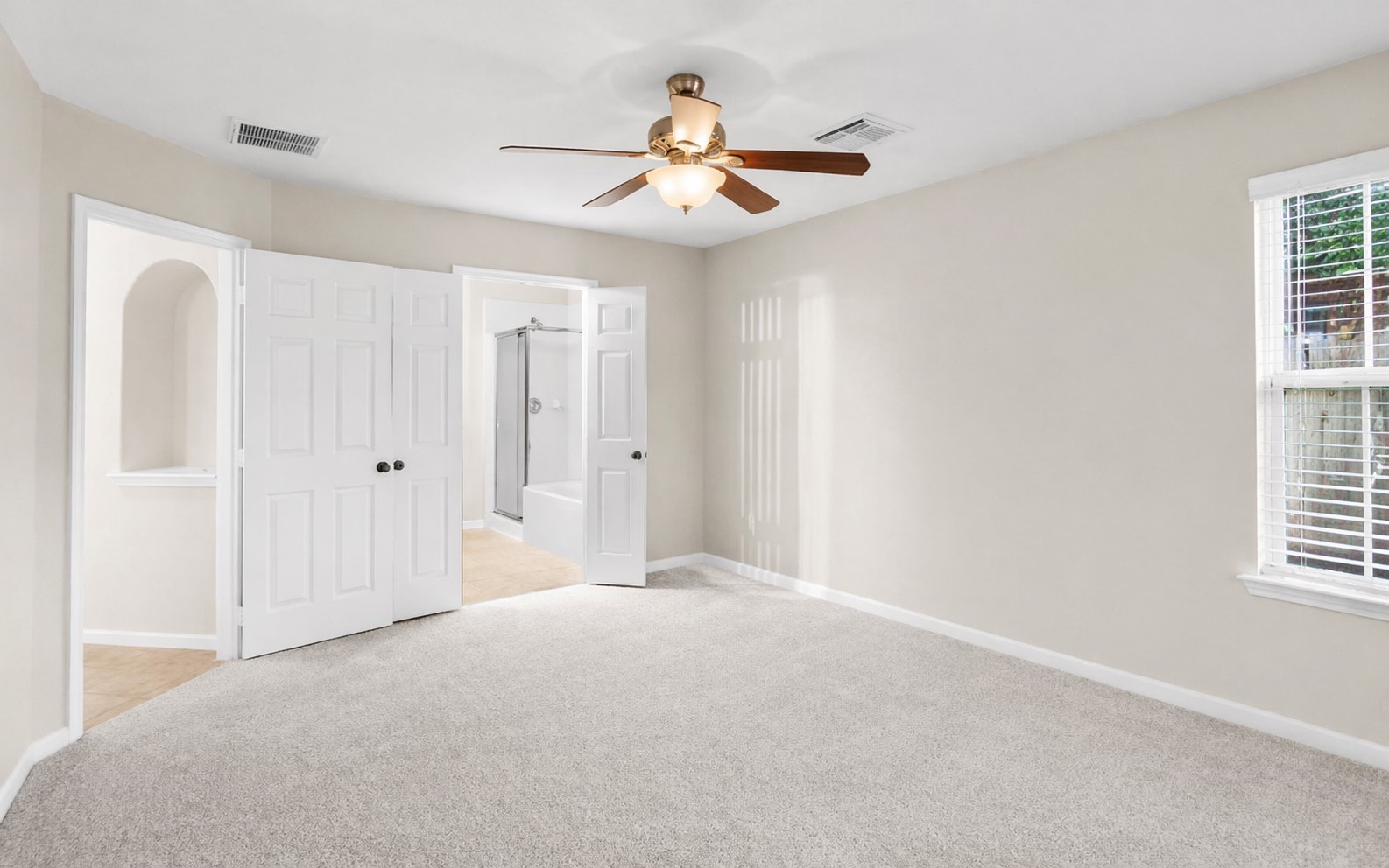 3522 Brackenfern Road Katy, TX 77449 - Photo 14 of 17 a view of a livingroom with a ceiling fan and windows