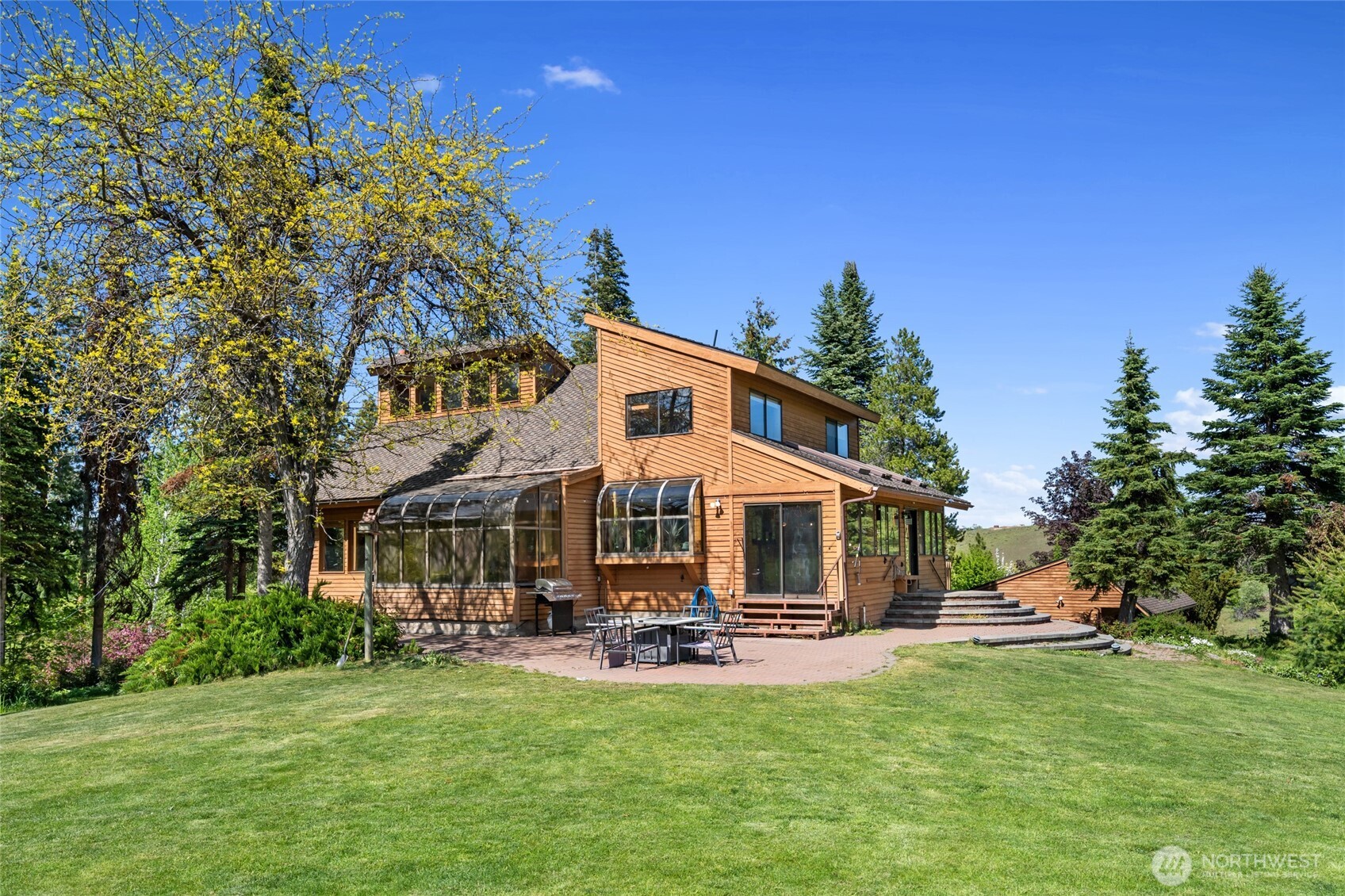 712 Moonlit Lane Wenatchee, WA 98801 - Photo 4 of 29 a view of a house with a yard porch and sitting area