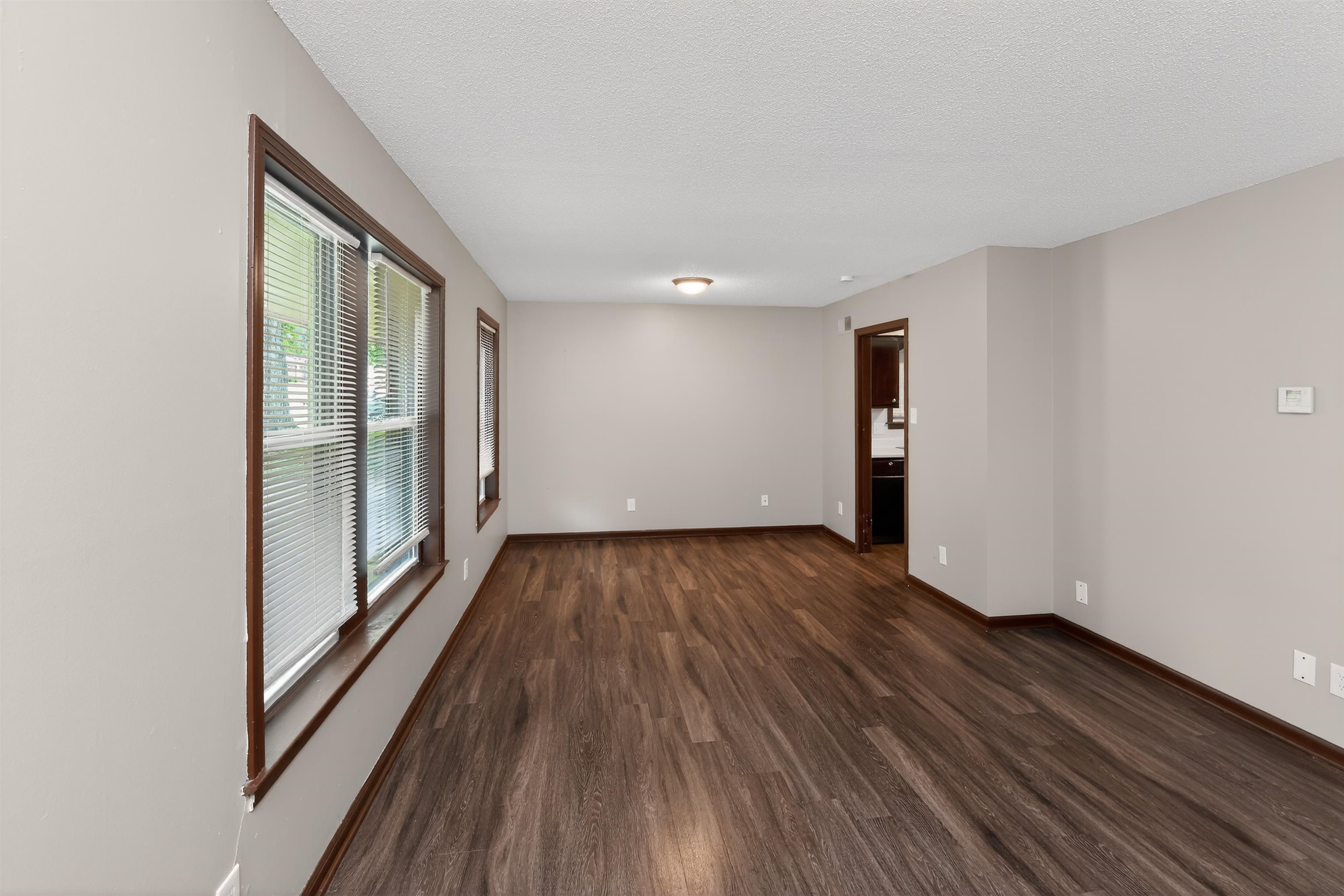 4206 Riche Road Memphis, TN 38128 - Photo 15 of 30 Spacious room featuring wood-finish flooring, neutral wall tones, multiple windows with blinds, and recessed lighting