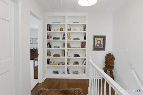 a view of a hallway with shelves