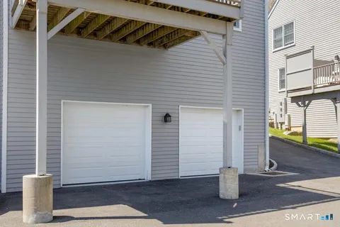 a front view of a house with garage