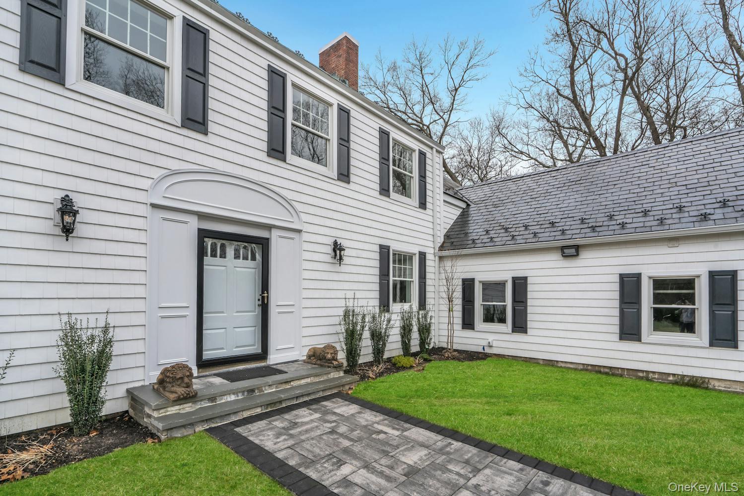 539 Split Rock Road Syosset, NY 11791 - Photo 5 of 40 Property entrance featuring a yard and a chimney