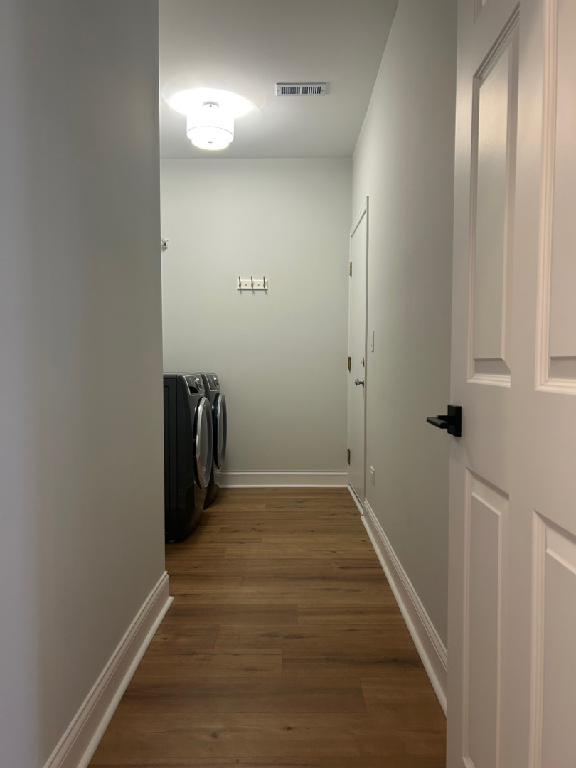 1501 Millbrook Drive Algonquin, IL 60102 - Photo 16 of 19 a view of a hallway with wooden floor