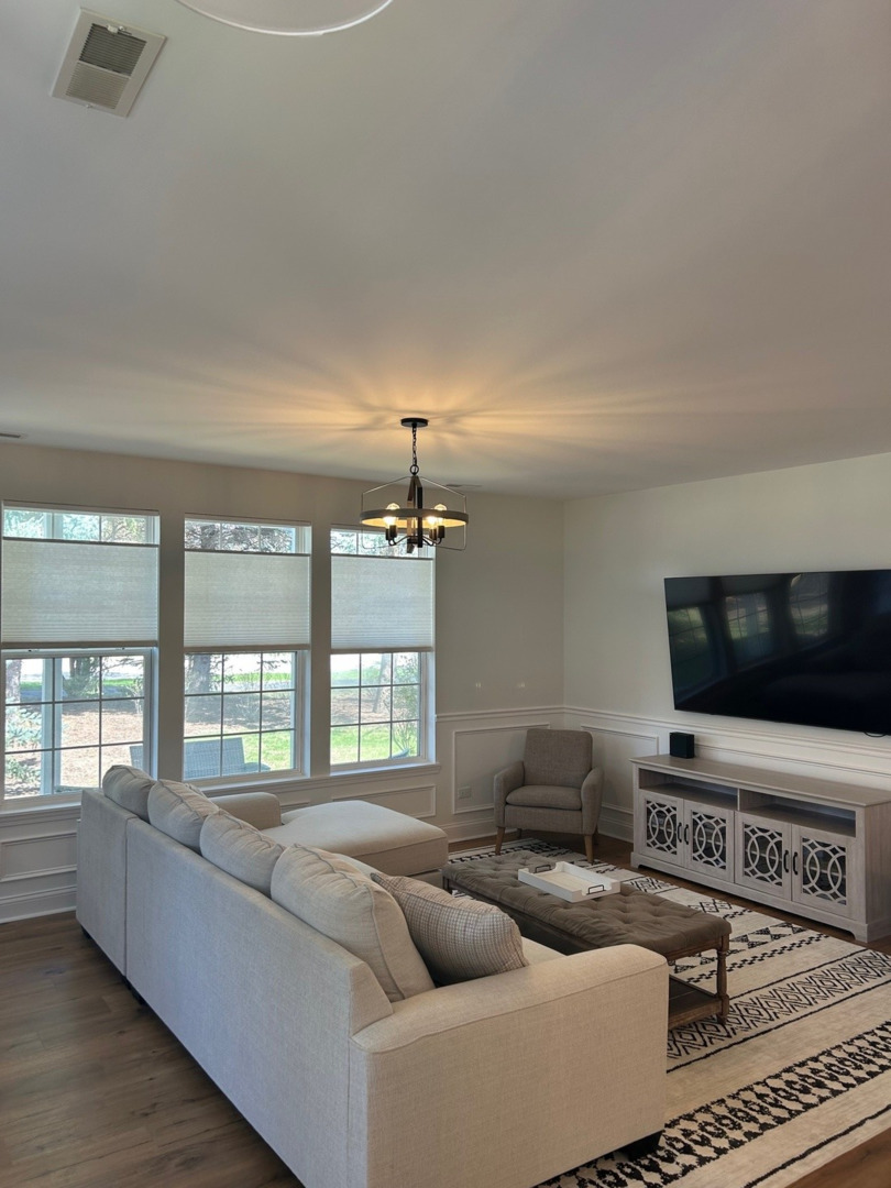 1501 Millbrook Drive Algonquin, IL 60102 - Photo 5 of 19 a living room with furniture and a flat screen tv