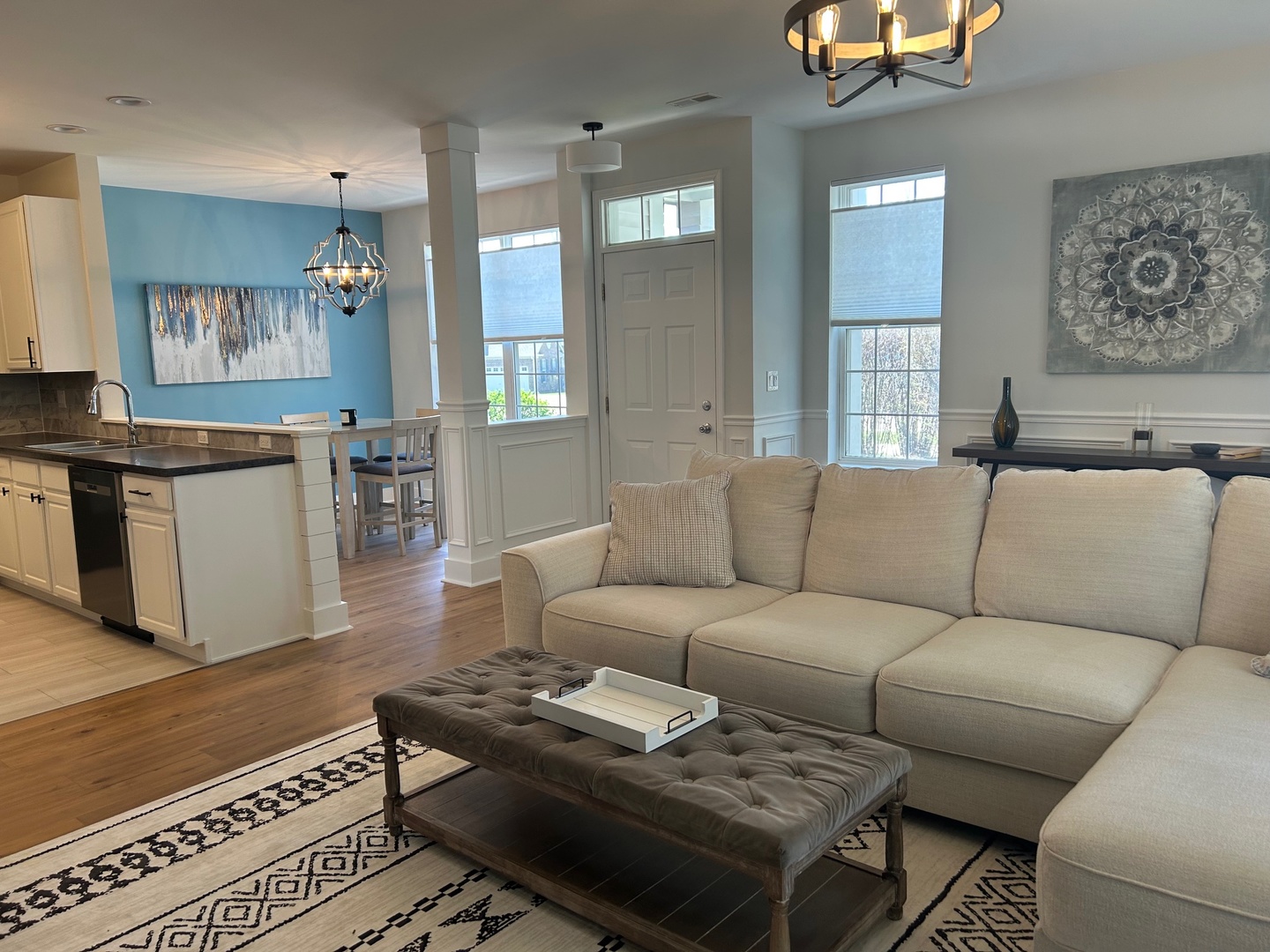 1501 Millbrook Drive Algonquin, IL 60102 - Photo 8 of 19 a living room with furniture a wooden floor and a chandelier