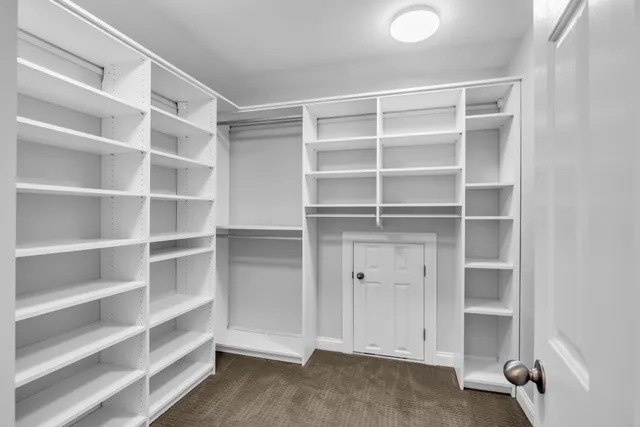 a view of an empty walk in closet