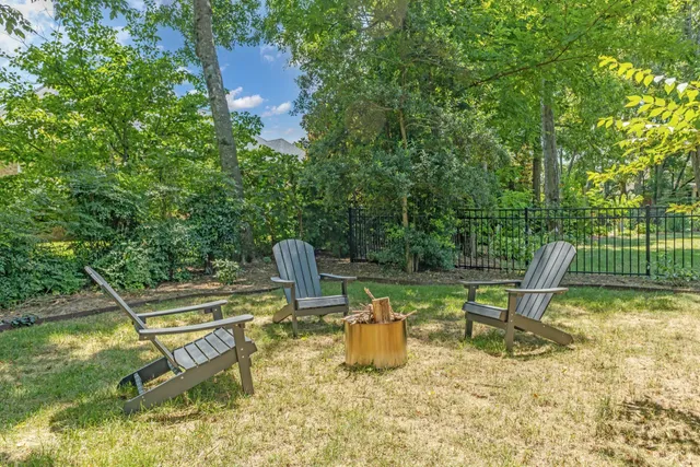 a view of a chair and table in the patio