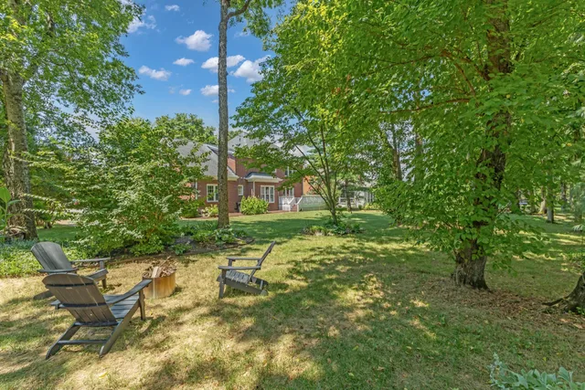 a view of a chairs in a backyard