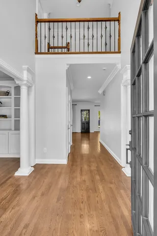a view of gallery with wooden floor