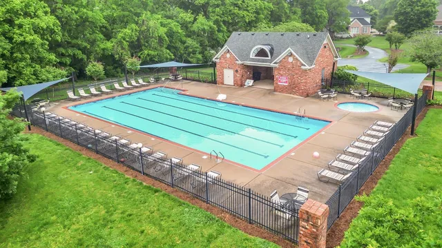 a wooden bench sitting in the middle of a park