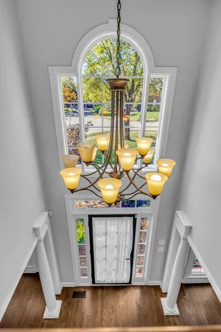 a dining room with furniture and a chandelier