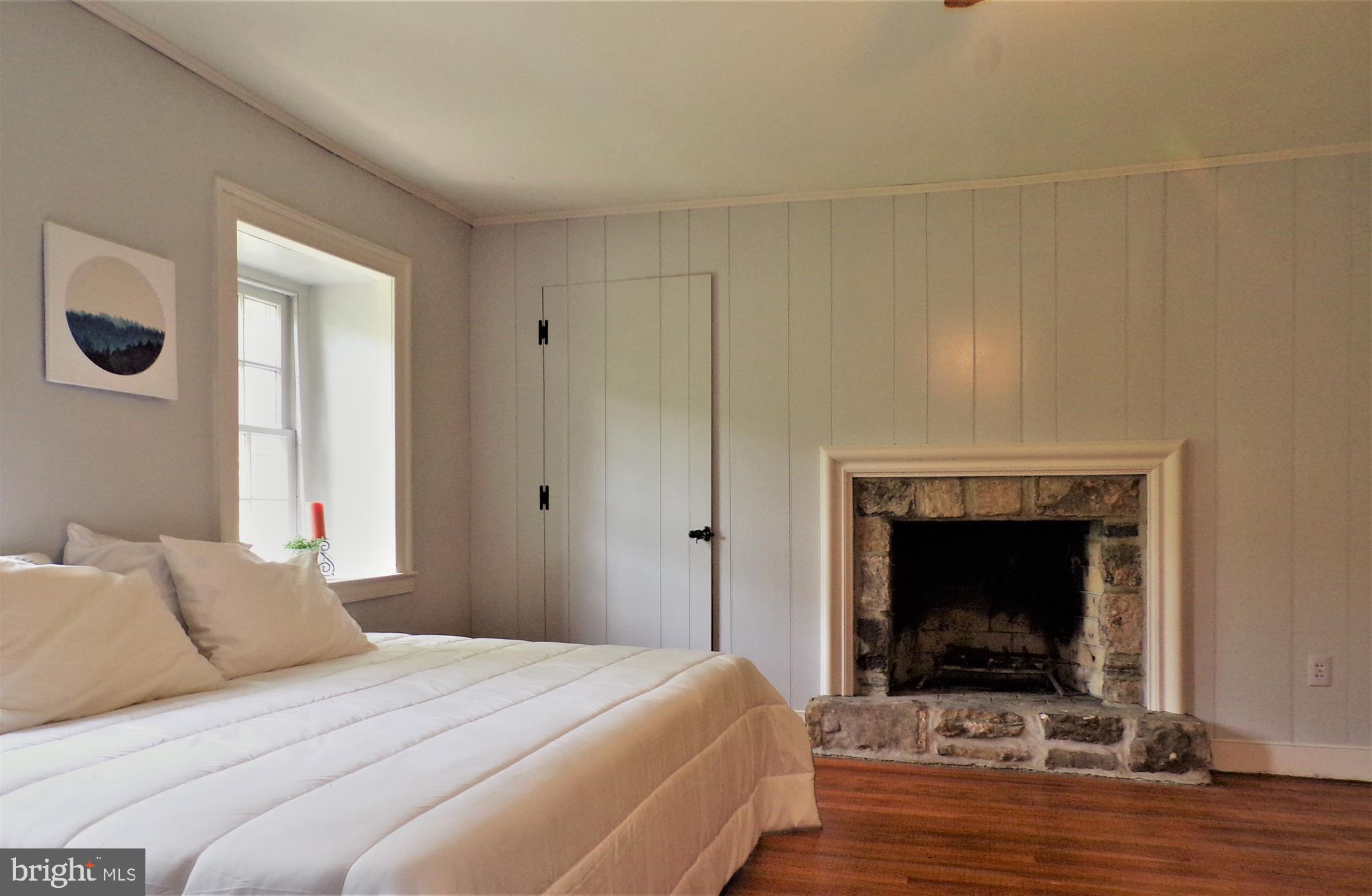 498 Dale Road Barto, PA 19504 - Photo 44 of 58 relaxing 2nd bedroom with stone fireplace
