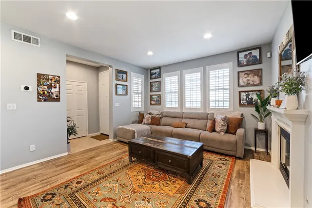 a living room with furniture and a rug