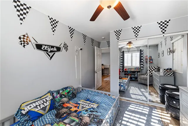 a bedroom with furniture and a window