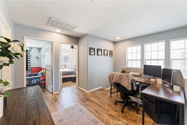 a workspace with furniture hardwood and a window