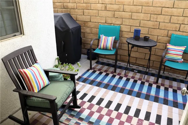 a living room with furniture and a rug