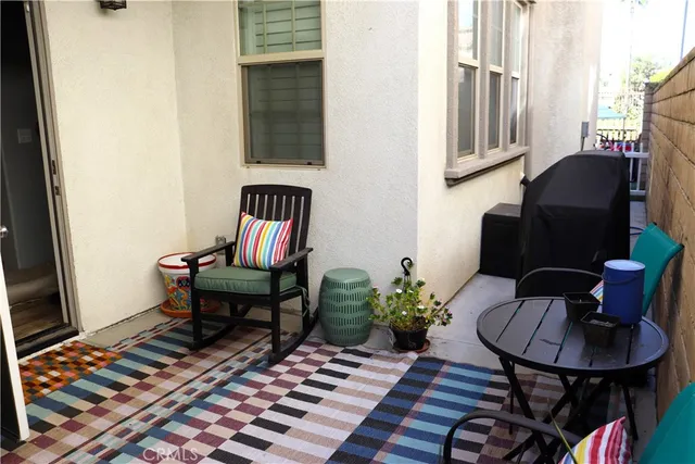 a living room with furniture and a rug