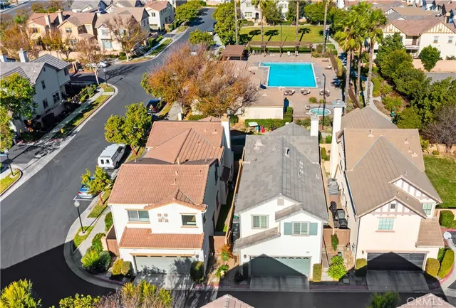 an aerial view of residential houses with outdoor space