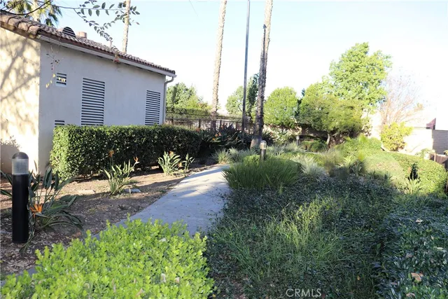 a backyard of a house with a yard and outdoor seating