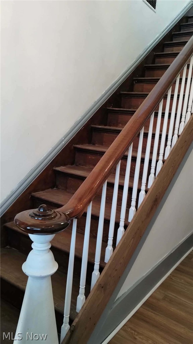 23033 Cadiz Road Freeport, OH 43973 - Photo 17 of 31 Staircase with wood finished floors and baseboards