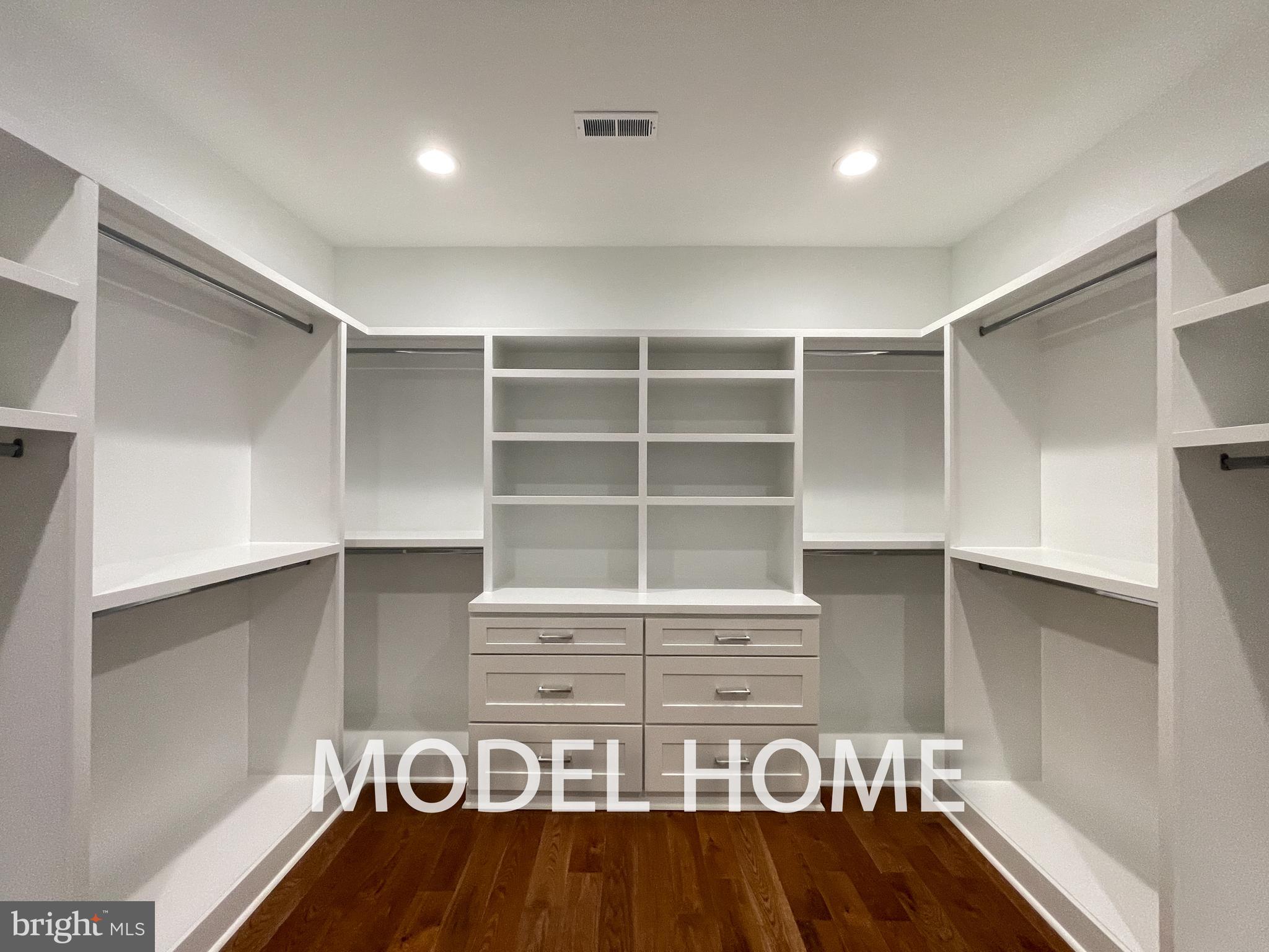 449 Lawyers Road Northwest Vienna, VA 22180 - Photo 31 of 49 a view of an empty room with wooden floor and closet