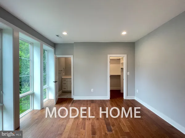 a view of an entryway with wooden floor