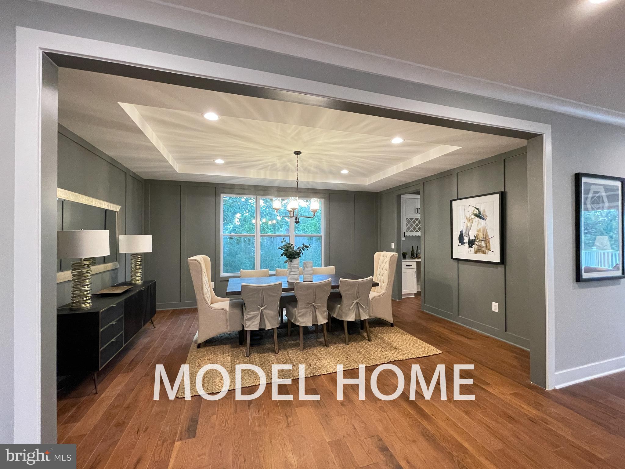449 Lawyers Road Northwest Vienna, VA 22180 - Photo 4 of 49 a living room with furniture and a large window