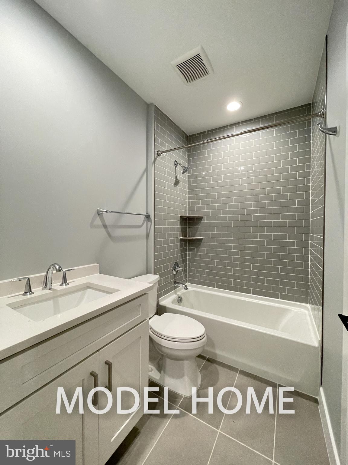 449 Lawyers Road Northwest Vienna, VA 22180 - Photo 45 of 49 a bathroom with a sink a toilet and shower