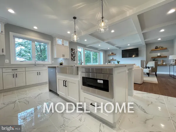 a kitchen with a stove a refrigerator and a sink