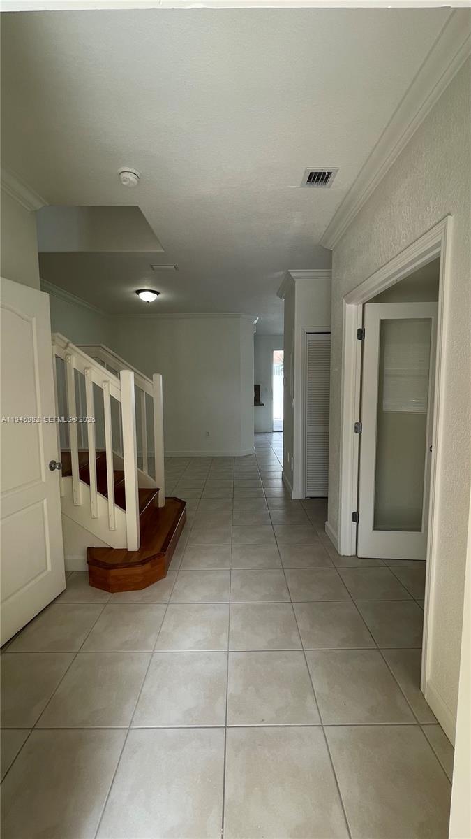 7020 Northwest 177th Street, Unit B103 Hialeah, FL 33015 - Photo 29 of 53 a view of a hallway with seating area