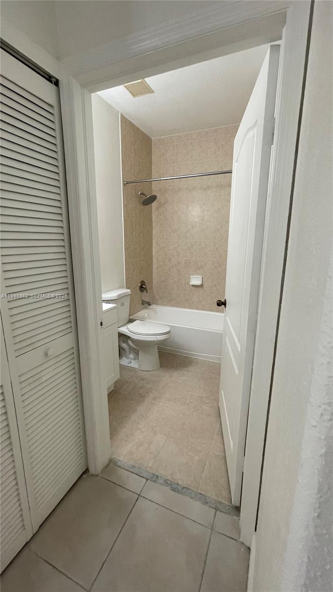 7020 Northwest 177th Street, Unit B103 Hialeah, FL 33015 - Photo 34 of 53 a bathroom with a sink and toilet