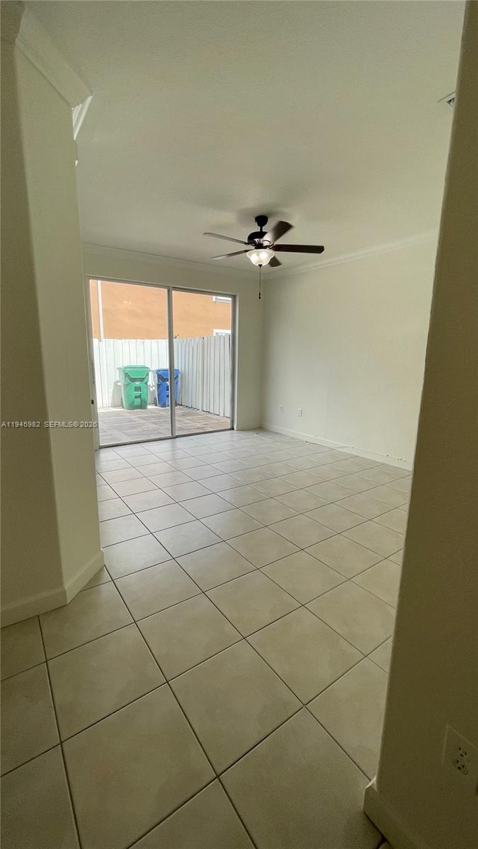 7020 Northwest 177th Street, Unit B103 Hialeah, FL 33015 - Photo 37 of 53 a view of an empty room and a window