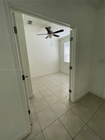 a bathroom with a glass door shower