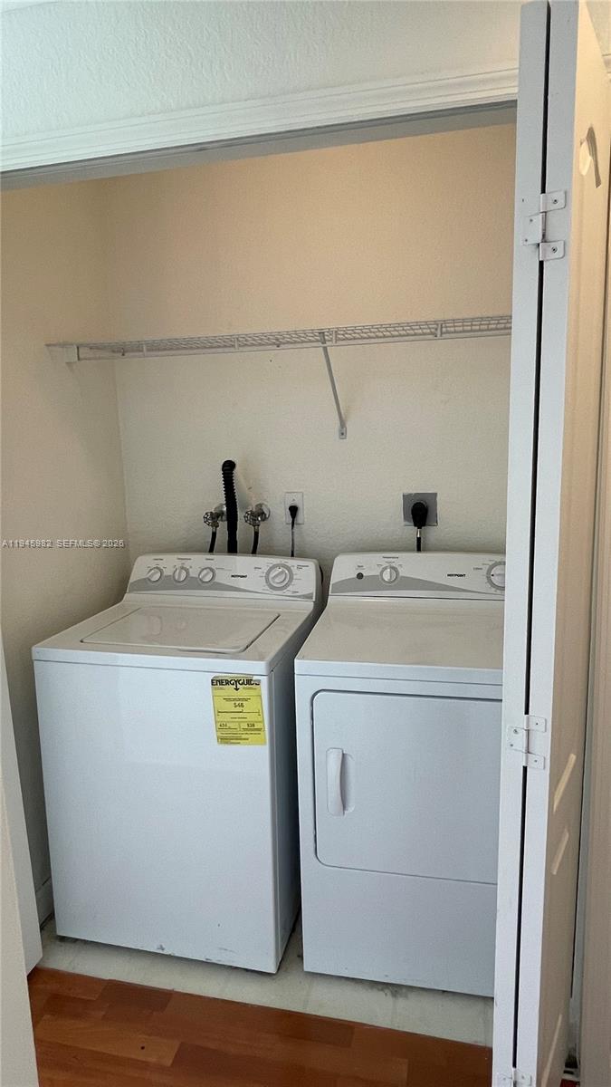 7020 Northwest 177th Street, Unit B103 Hialeah, FL 33015 - Photo 43 of 53 a utility room with dryer and washer